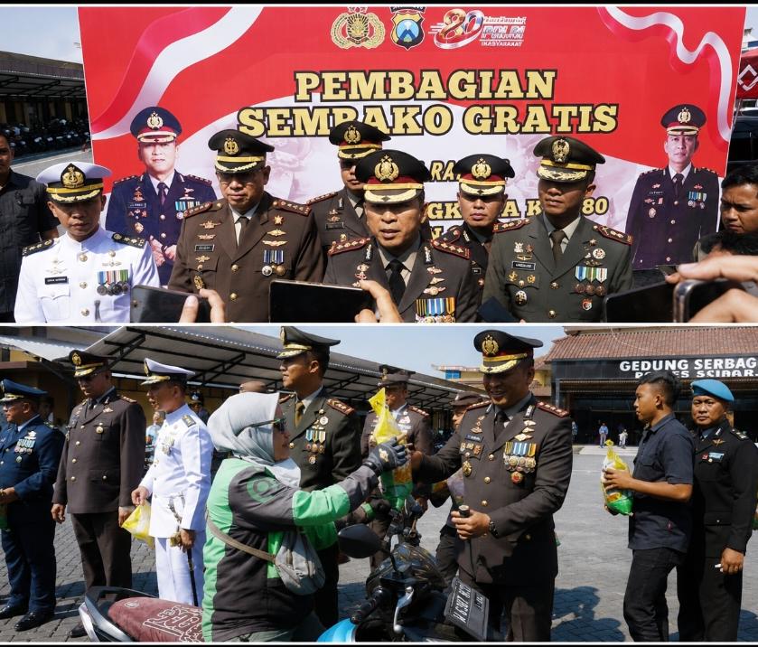 Kapolresta Sidoarjo bersama Forkopimda membagikan bantuan sosial tiga ton beras kepada masyarakat pada Hari Bhayangkara ke-80.